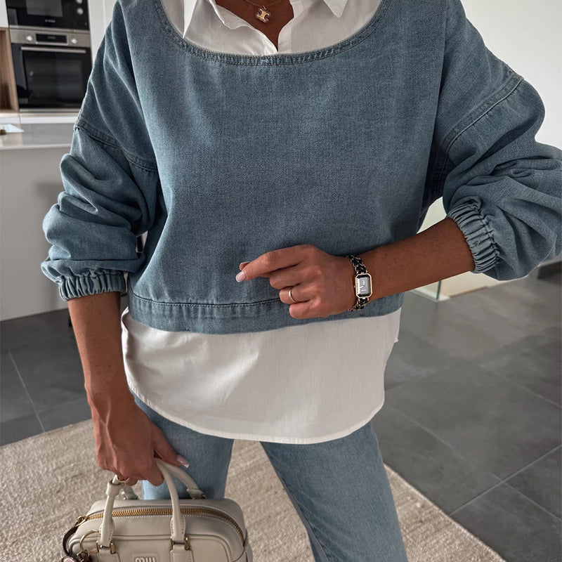 Modische zweiteilige Set bestehend aus einer langärmeligen Jeansbluse und einer Hose für Frauen